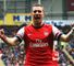 Lukas Podolski: Celebrates scoring in the 3-0 win over Hull City