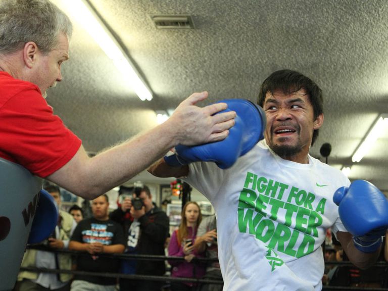 Manny Pacquiao works out with trainer Freddie Roach