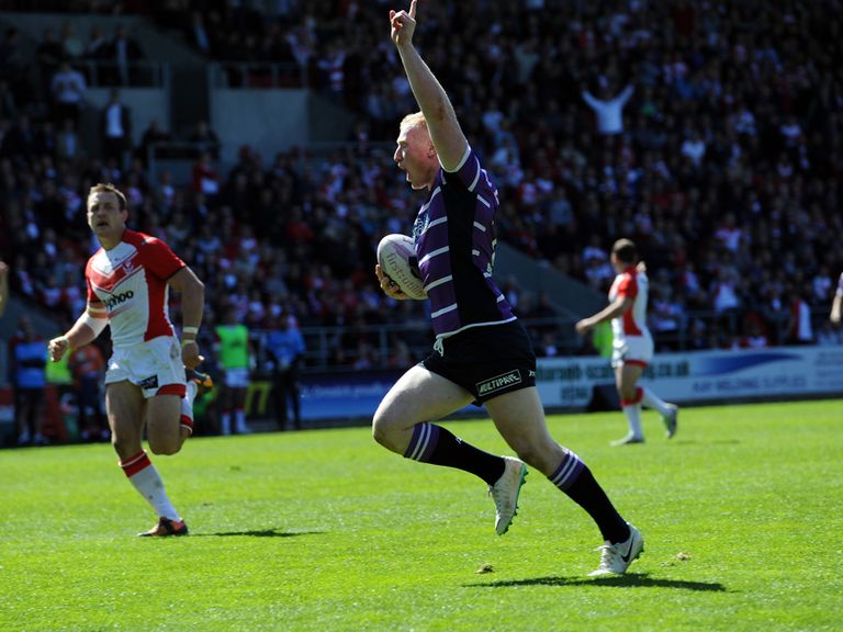 Liam Farrell celebrates scoring one of his tries