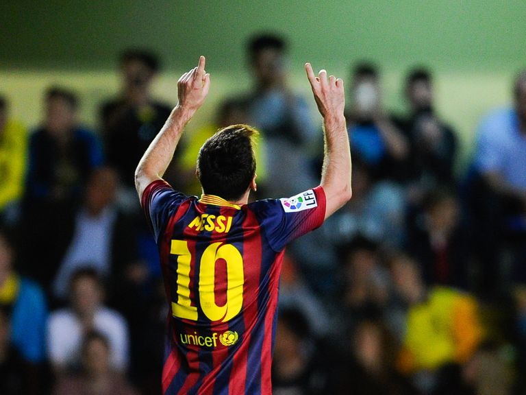 Lionel Messi celebrates after scoring his team's third goal on Sunday