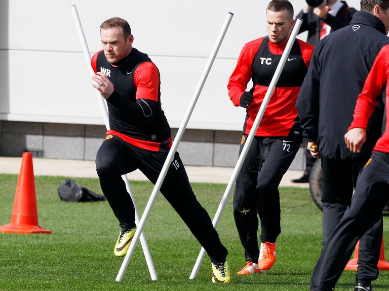 Wayne Rooney in full flow at Carrington during United's training session
