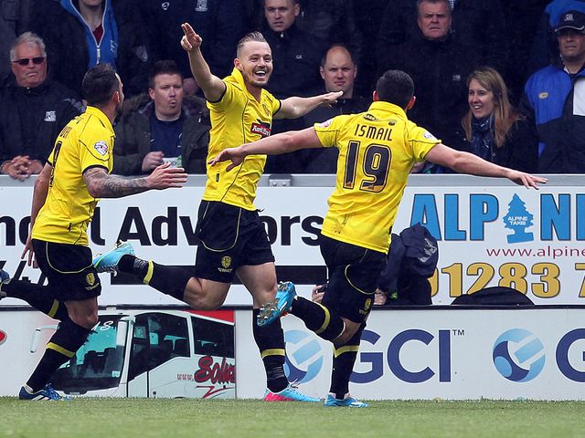 Adam McGurk celebrates the decisive goal for Burton