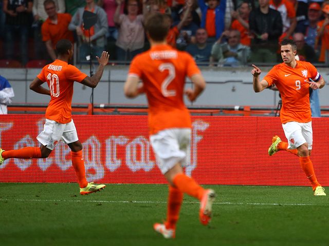 Robin van Persie celebrates his equaliser