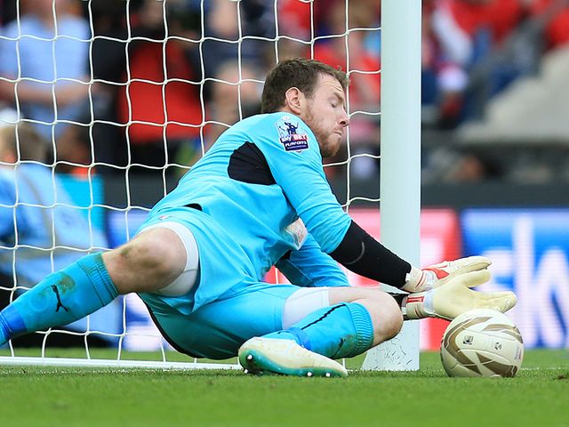 Adam Collin saves a penalty at Wembley