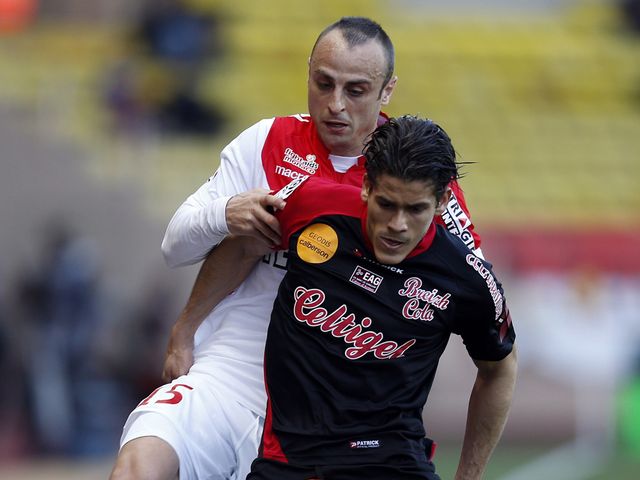 Monaco's Dimitar Berbatov challenges Dorian Leveque