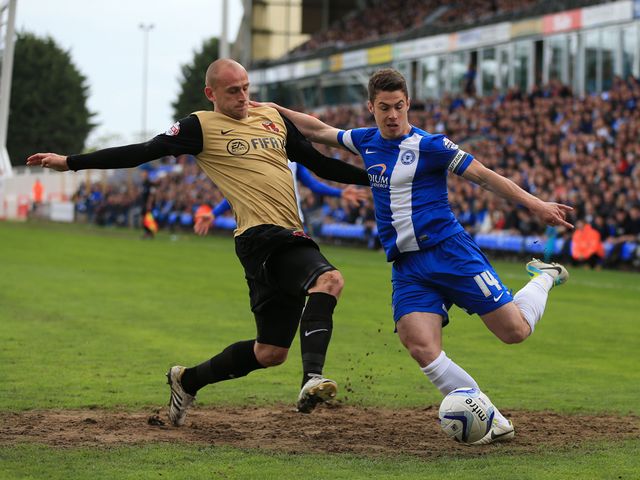 Tommy Rowe tries to get away from Scott Cuthbert