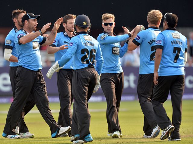Sussex celebrate taking the wicket of Eoin Morgan