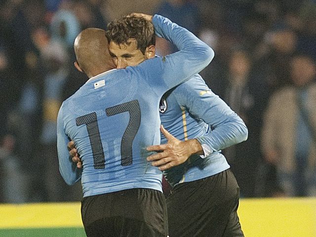 Arevalo Rios and Cristhian Stuani celebrate for Uruguay