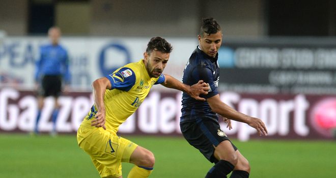 Ivan Radovanovic (left) of Chievo in action on Sunday
