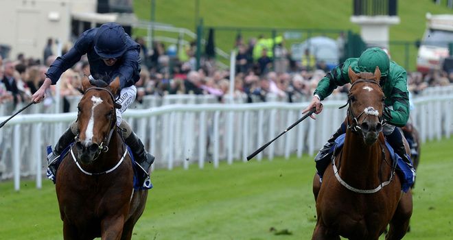 Orchestra (left) ridden by Ryan Moore wins the MBNA Chester Vase from Romsdal