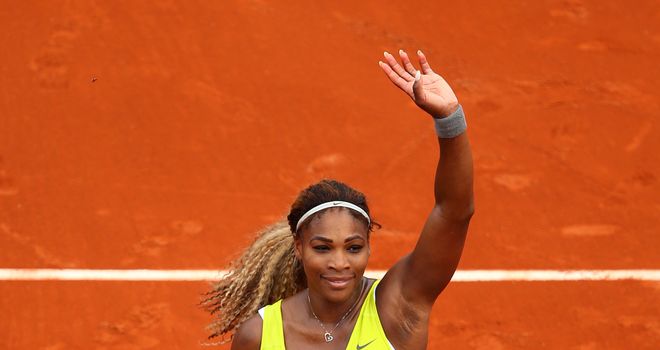 Defending champion Serena Williams celebrates victory over Alize Lim on day one of the French Open