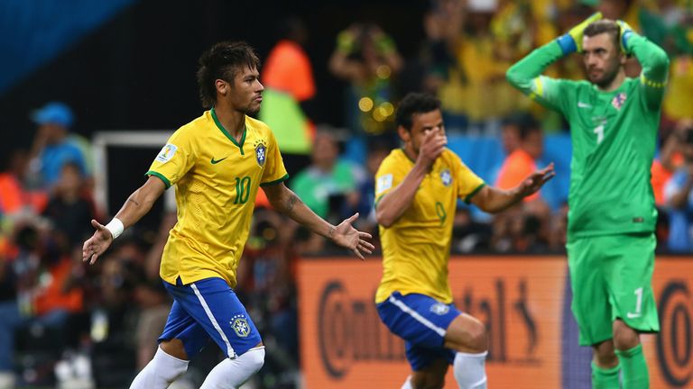 Neymar celebrates after scoring from the spot