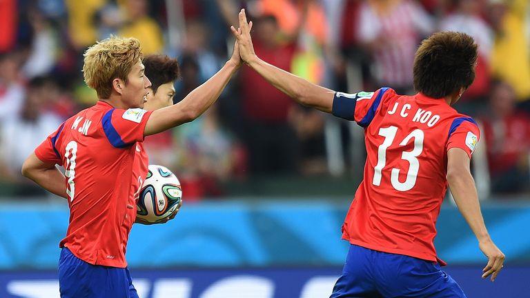 Son Heung-Min (l): Celebrates with forward Koo Ja-Cheol after scoring his team's first goal