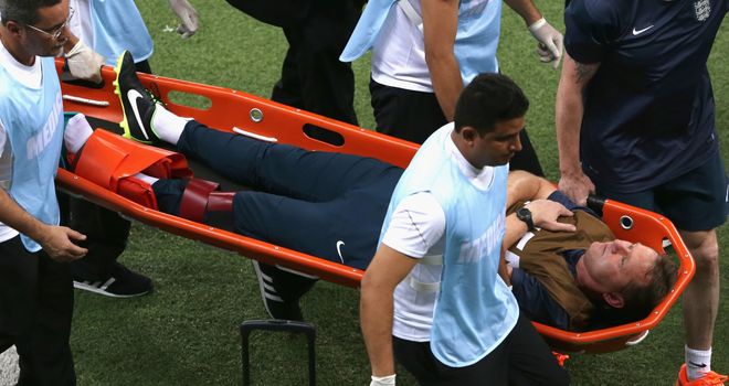 England trainer Gary Lewin is stretchered off the field after dislocating his ankle