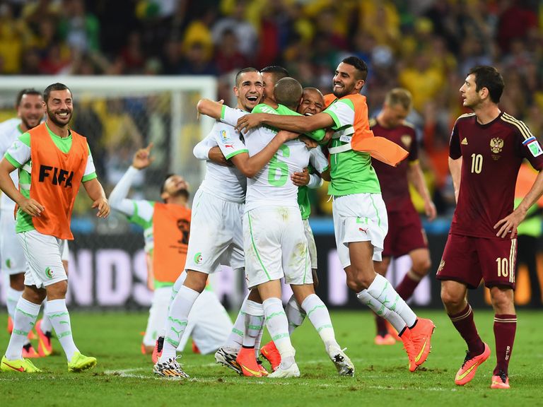 Algeria celebrate reaching the World Cup knockout stages