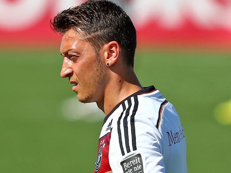 Mesut Ozil: Supported by team mate Lucas Podolski