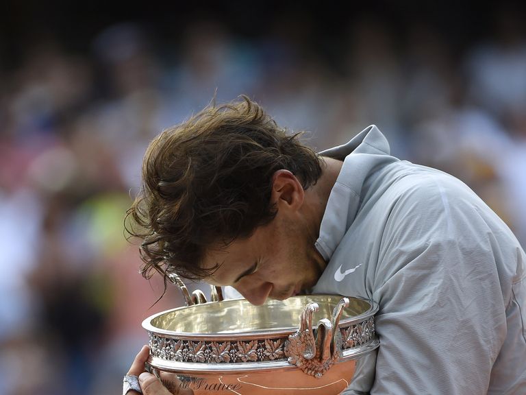 Nadal holds the trophy after winning his ninth French Open title