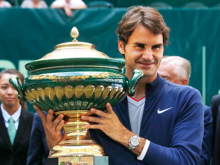 Roger Federer celebrates after beating Alejandro Falla in Halle