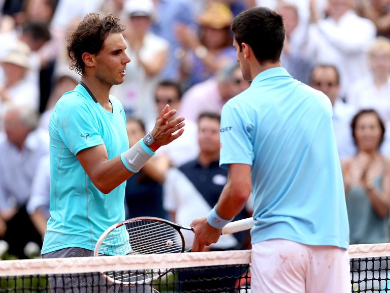 Nadal and Djokovic shake hands at the net