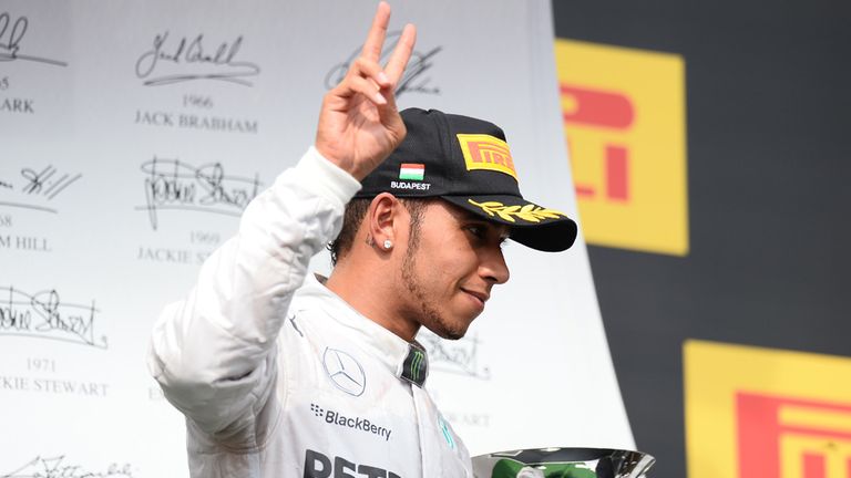 Hamilton gave a victory salute as he marched on to the podium