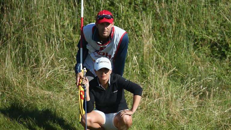 America's Mo Martin and her caddie line up a putt at Royal Birkdale