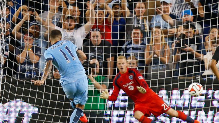 Aleksandar Kolarov of Manchester City scores a penalty in the win over Kansas