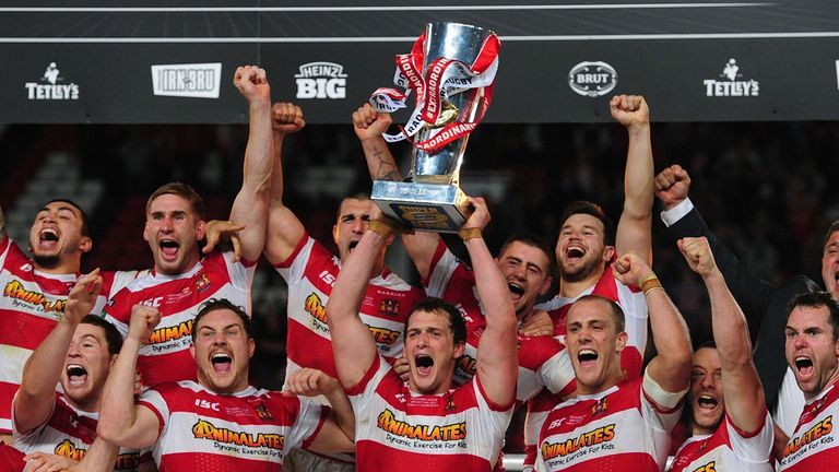 Wigan Warriors celebrate after winning Super League's Grand Final in 2013.