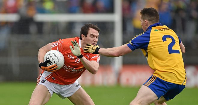 Armagh forward Tony Kernan is tackled by Seanie McDermott