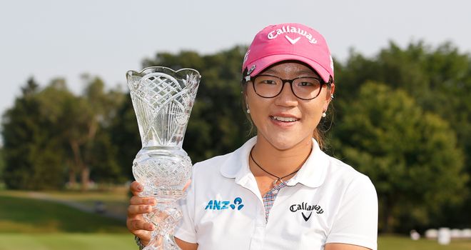 Lydia Ko poses with the trophy after winning the Marathon Classic 