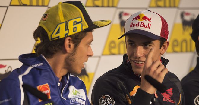 Marc Marquez (r) and Valentino Rossi chat during a press conference in Germany this week