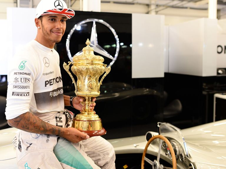 Lewis Hamilton with the spoils of victory at Silverstone