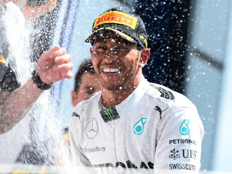 Race winner Lewis Hamilton celebrates