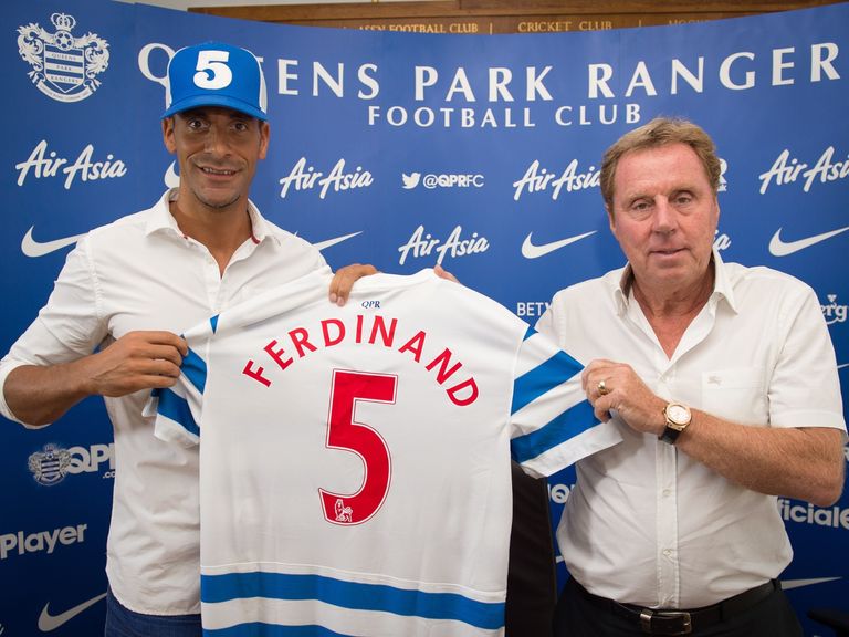 Queens Park Rangers' Rio Ferdinand and manager Harry Redknapp