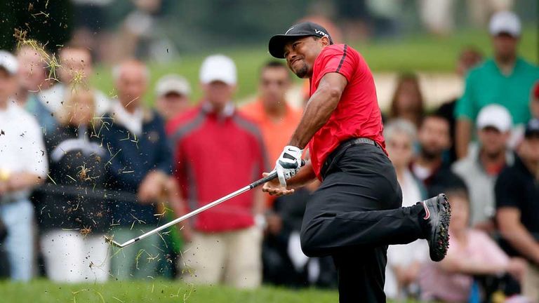 Tiger Woods hits his second shot on the second hole at Firestone