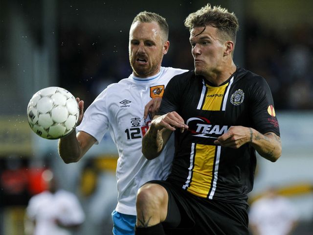 Hull's David Meyler (l) battles for possession