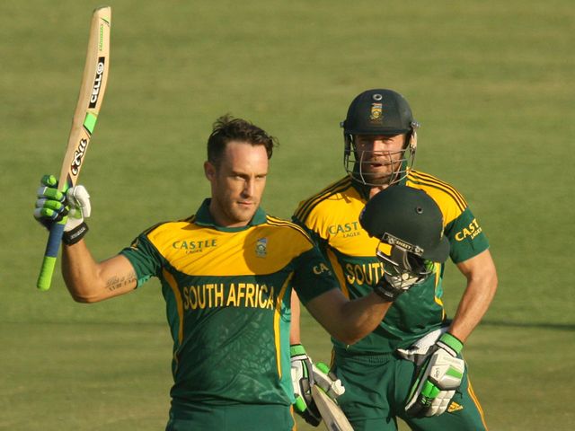 Faf du Plessis (l) celebrates his century with captain AB de Villiers