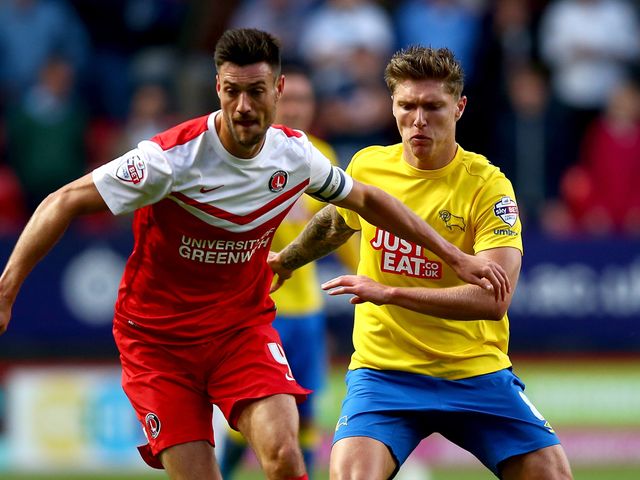 Johnnie Jackson of Charlton controls the ball from Jeff Hendrik