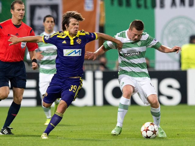 Damjan Bohan and Callum McGregor battle for the ball