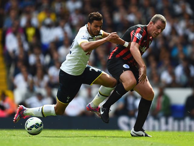 Richard Dunne and Nacer Chadli tangle