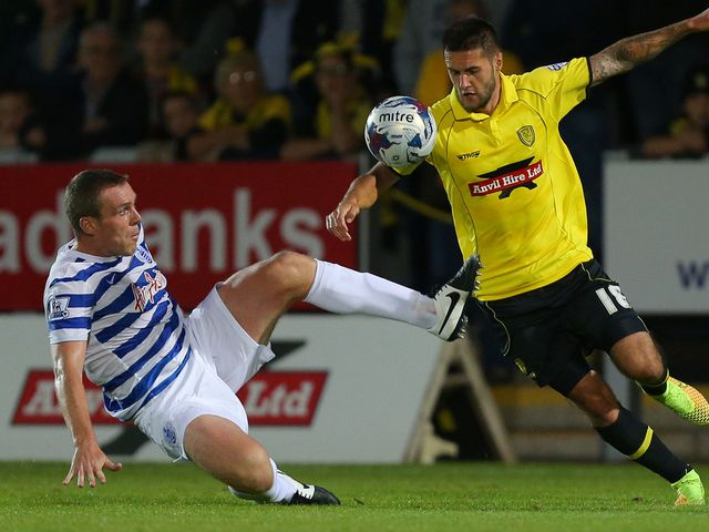 Richard Dunne and Dominic Knowles compete for the ball