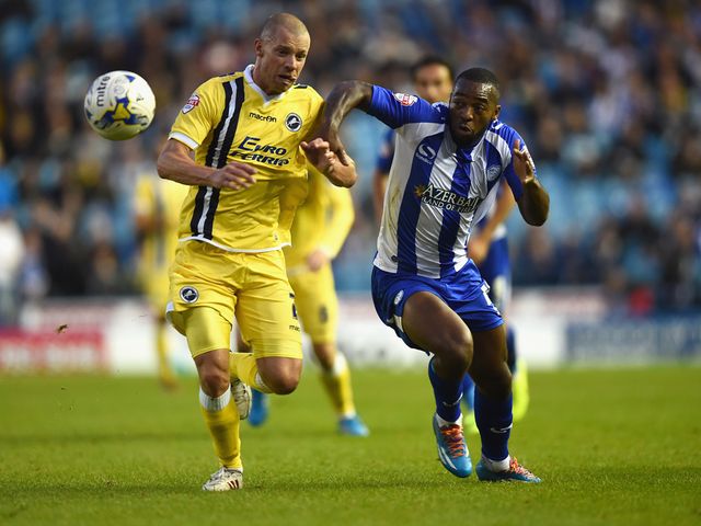 Jaques Maghoma battles with Alan Dunne of Millwall