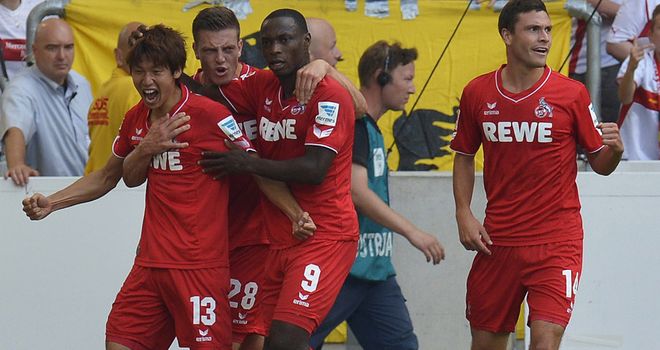 Cologne's Japanese forward Yuya Osako (l) celebrates his goal