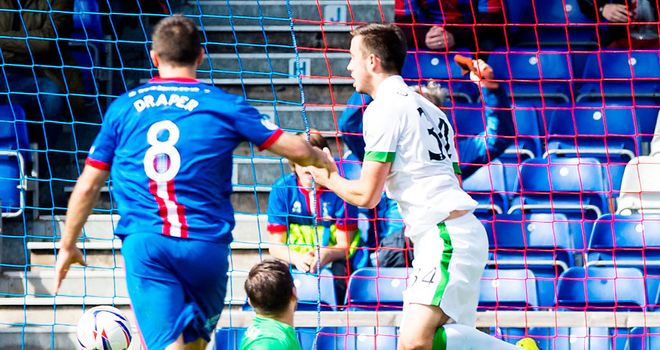 Inverness Caley score as the ball rebounds off young Celtic defender Eoghan O'Connell (r)