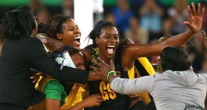 Romelda Aiken and her Jamaican team-mates celebrate victory against England in the bronze medal match
