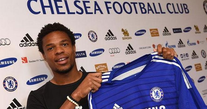 Loic Remy: Poses with his Chelsea shirt after signing from QPR