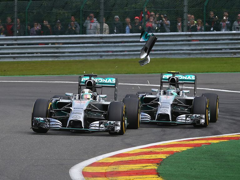 Rosberg (r) clips Hamilton during the Belgian Grand Prix