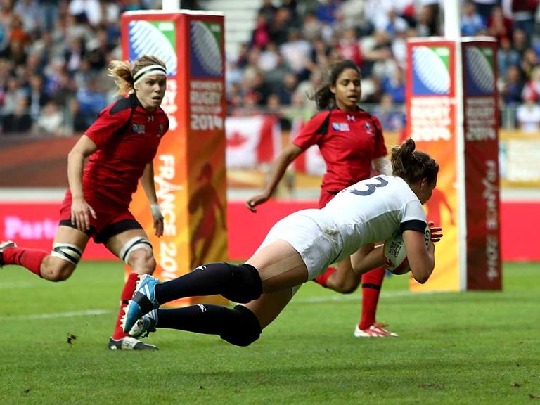 Emily Scarratt of England dives over for a try against Canada