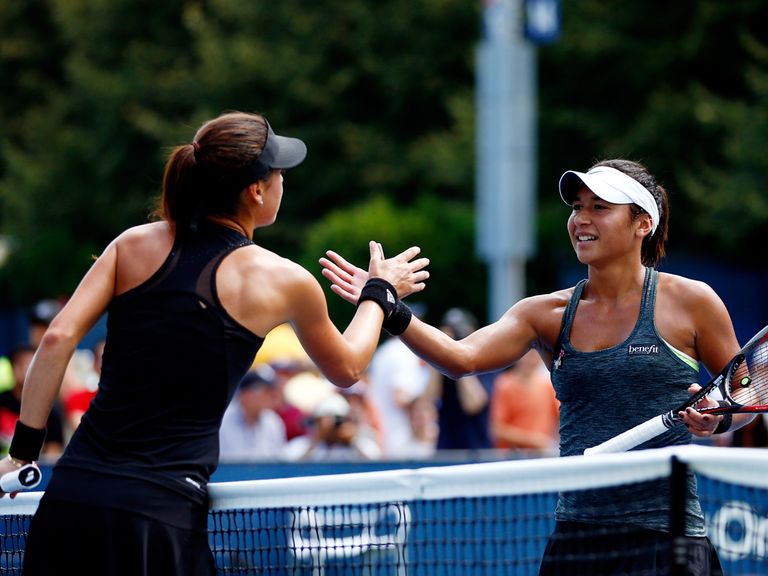 Heather Watson (r) shakes hands with Sorana Cirstea