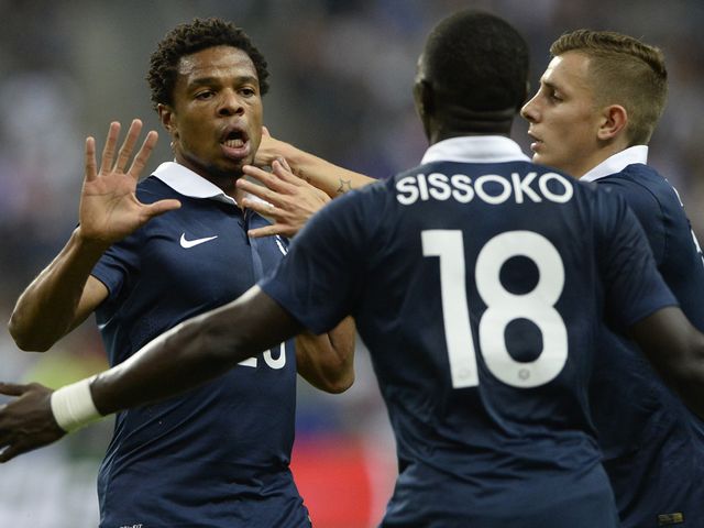 Loic Remy celebrates after scoring against Spain