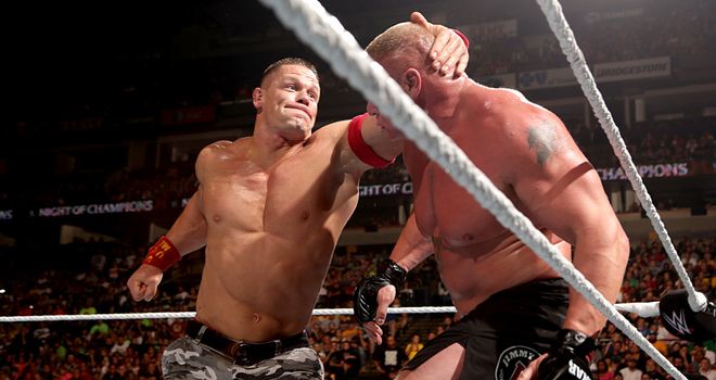 John Cena attacks Brock Lesnar in the corner of the ring